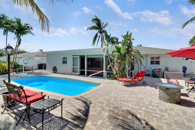 view of swimming pool featuring a patio area and central AC