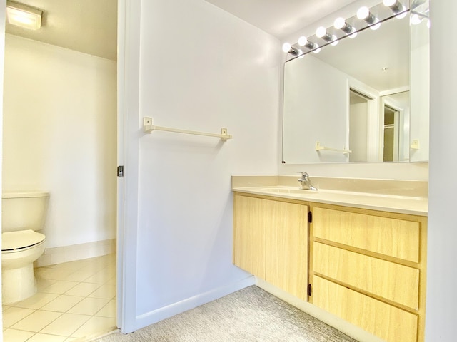 bathroom featuring tile patterned floors, vanity, and toilet