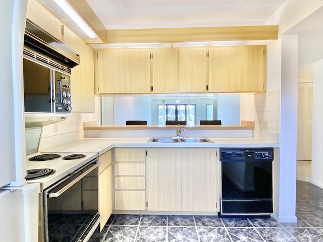 kitchen featuring light brown cabinetry, sink, and black appliances