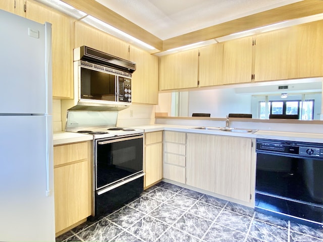 kitchen with white appliances, light brown cabinets, and sink