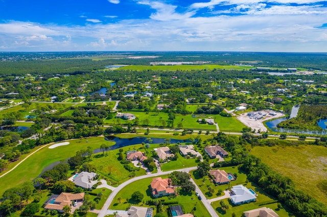 bird's eye view featuring a water view, view of golf course, and a residential view