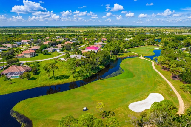birds eye view of property featuring a water view, a residential view, and golf course view