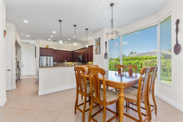 dining space featuring light tile patterned flooring, baseboards, recessed lighting, and visible vents