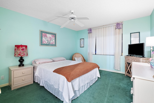 carpeted bedroom featuring ceiling fan and a textured ceiling