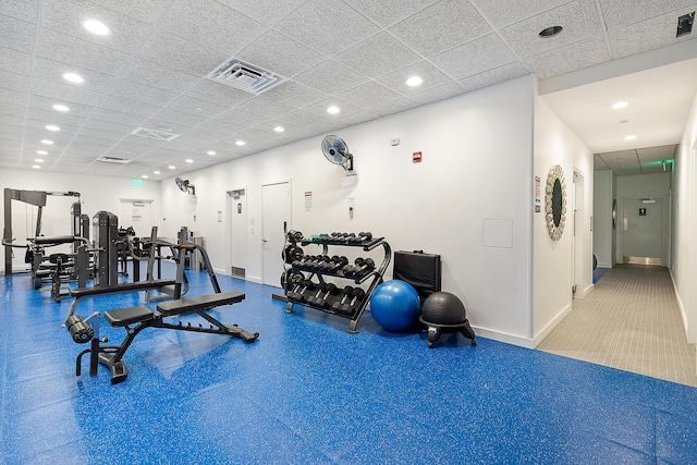 gym featuring a drop ceiling