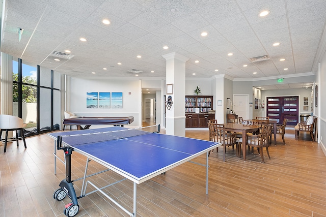 playroom with pool table, crown molding, expansive windows, and light hardwood / wood-style flooring