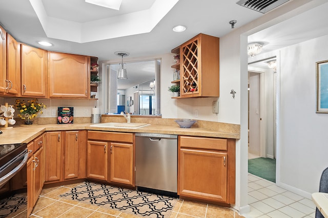 kitchen with dishwasher, hanging light fixtures, and light tile patterned flooring