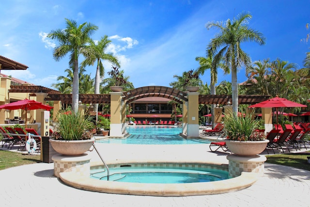 view of swimming pool featuring a community hot tub