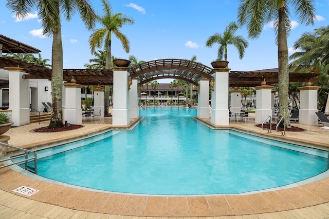 view of swimming pool featuring a patio area