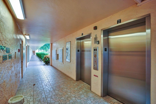 hallway featuring elevator