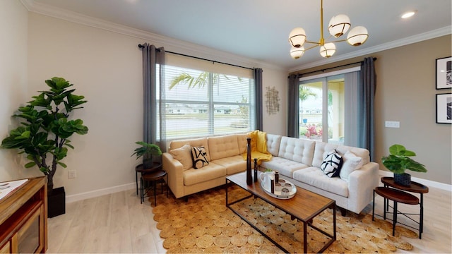 living room featuring an inviting chandelier, ornamental molding, and light wood-type flooring