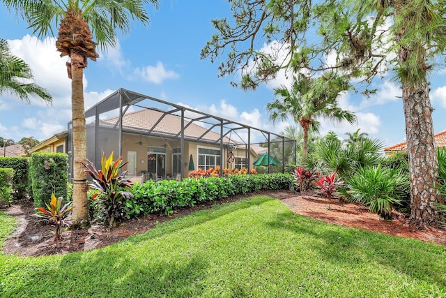 view of yard featuring glass enclosure