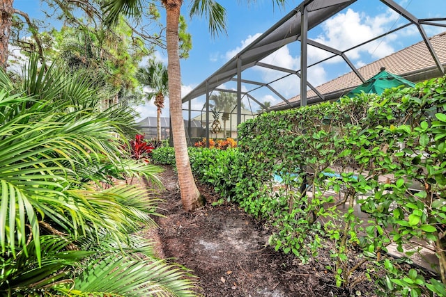 view of yard featuring a lanai