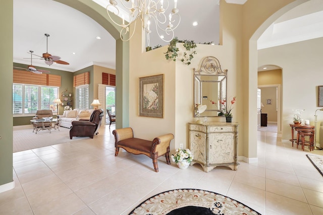 interior space featuring ornamental molding, a chandelier, and light tile patterned floors