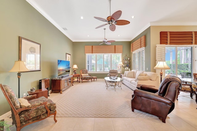 tiled living room with ceiling fan, plenty of natural light, and crown molding