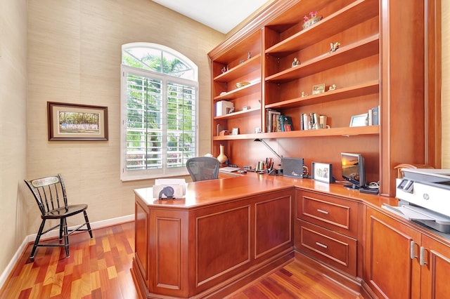 office with light hardwood / wood-style flooring