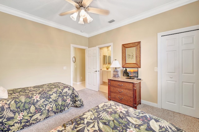 bedroom featuring ornamental molding, ceiling fan, and a closet