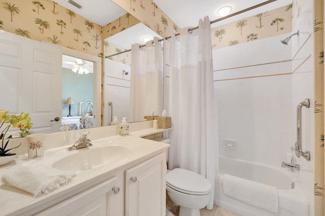 full bathroom with shower / tub combo, ceiling fan, vanity, and toilet