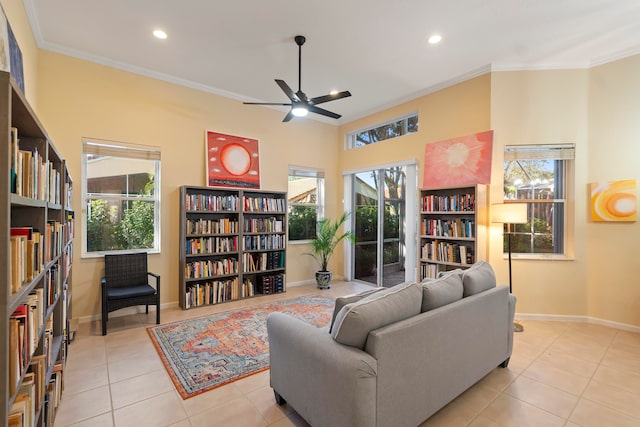 tiled living room with crown molding, ceiling fan, and a wealth of natural light