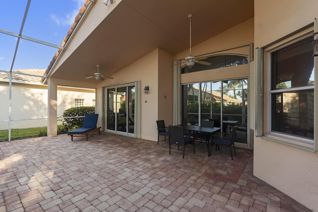 view of patio / terrace with ceiling fan and a lanai