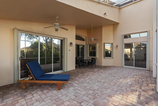 view of patio featuring ceiling fan