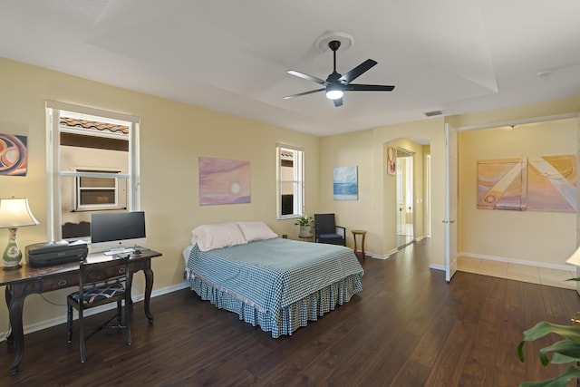 bedroom featuring ceiling fan and dark wood-type flooring