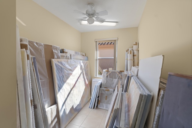 miscellaneous room featuring light tile patterned flooring and ceiling fan