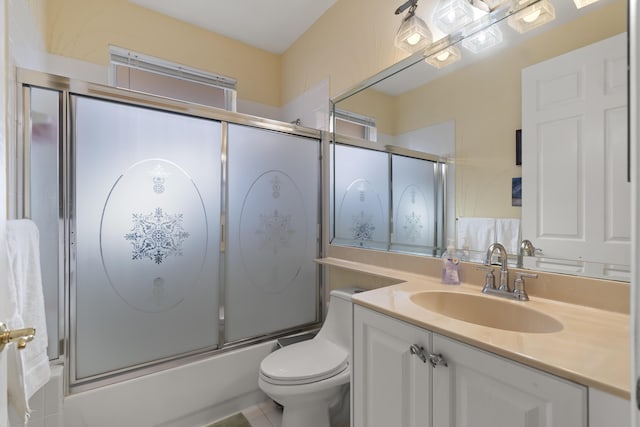 full bathroom featuring toilet, vanity, and enclosed tub / shower combo