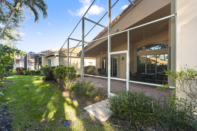 view of yard featuring a patio and a lanai