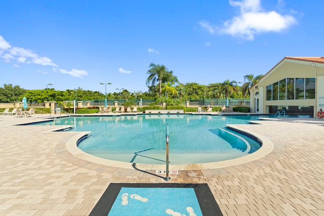 view of swimming pool with a patio