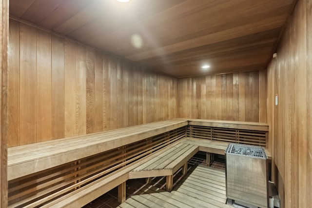 view of sauna / steam room with hardwood / wood-style floors, wooden walls, and wooden ceiling