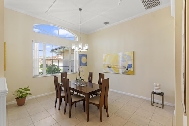 dining space featuring light tile patterned floors, a notable chandelier, and ornamental molding