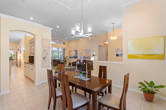 tiled dining space with crown molding and a chandelier