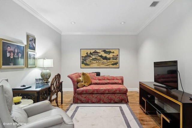 living room featuring light wood-type flooring and ornamental molding