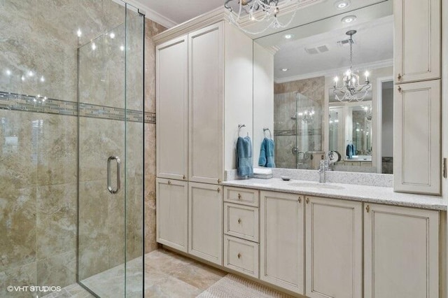 bathroom with a notable chandelier, walk in shower, vanity, and crown molding