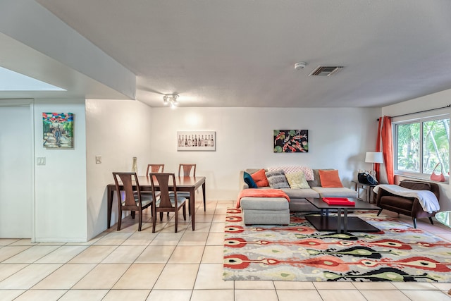 living room with light tile patterned flooring