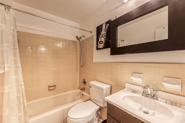 full bathroom featuring shower / bath combo, toilet, tile walls, and vanity