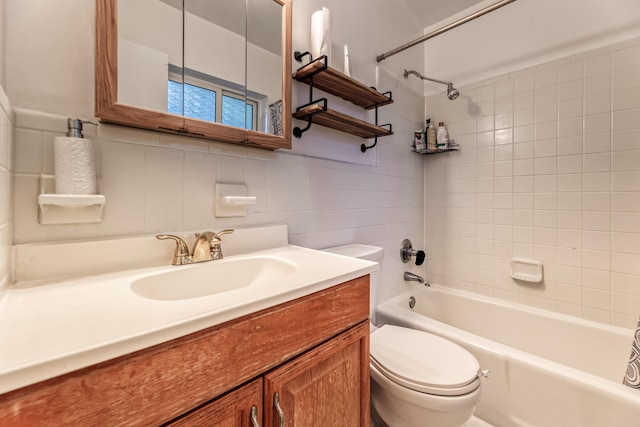 full bathroom featuring vanity, tasteful backsplash, toilet, and tiled shower / bath combo