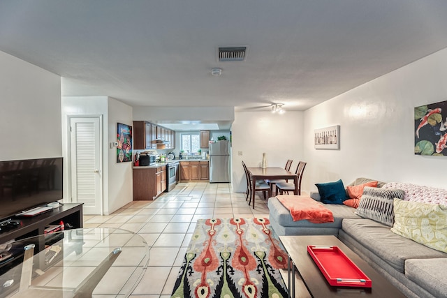 living room featuring light tile patterned floors and a textured ceiling