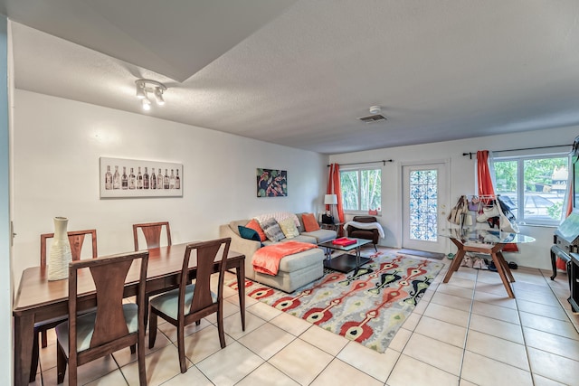 tiled living room with a textured ceiling