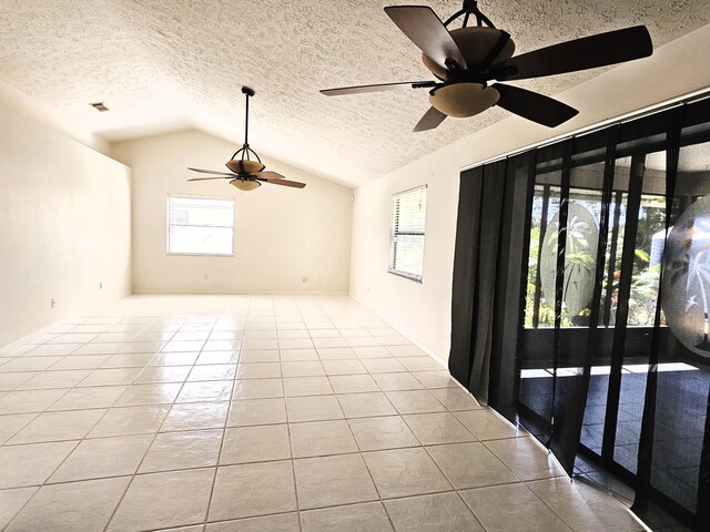 kitchen featuring sink, light tile patterned floors, dishwasher, and dark stone counters