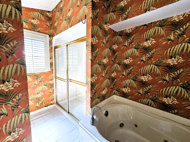 bedroom with ceiling fan, a textured ceiling, and light tile patterned floors