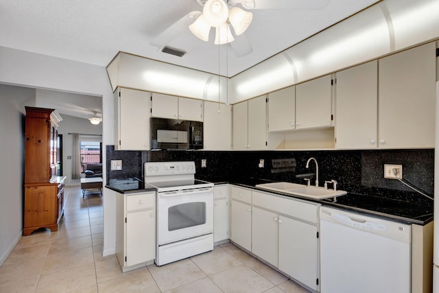 kitchen featuring decorative backsplash, white appliances, light tile patterned floors, ceiling fan, and sink