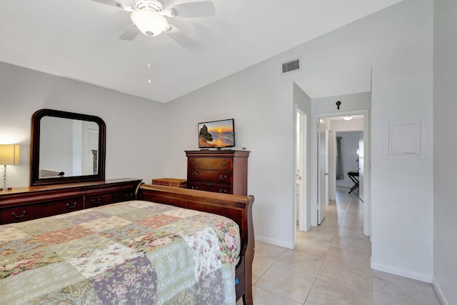 tiled bedroom featuring lofted ceiling and ceiling fan