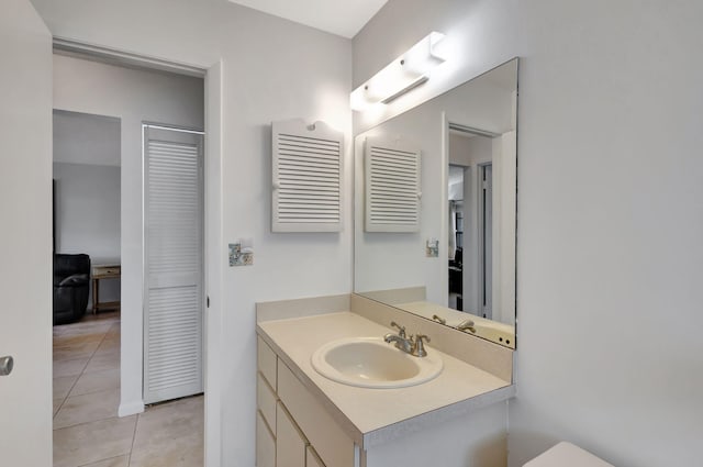 bathroom with vanity and tile patterned floors