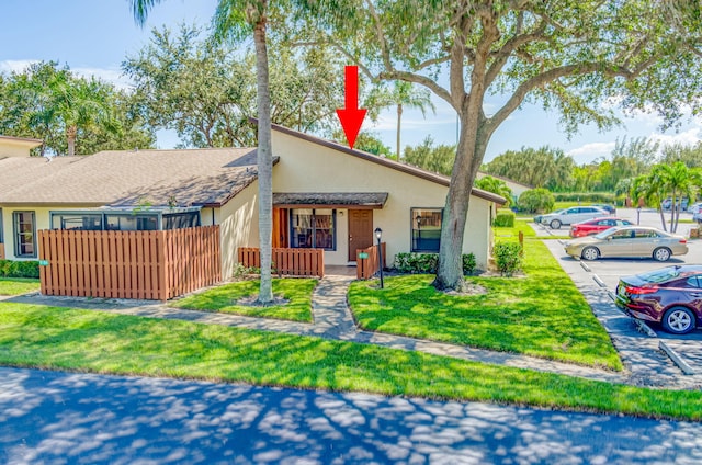 view of front of house featuring a front lawn and a porch