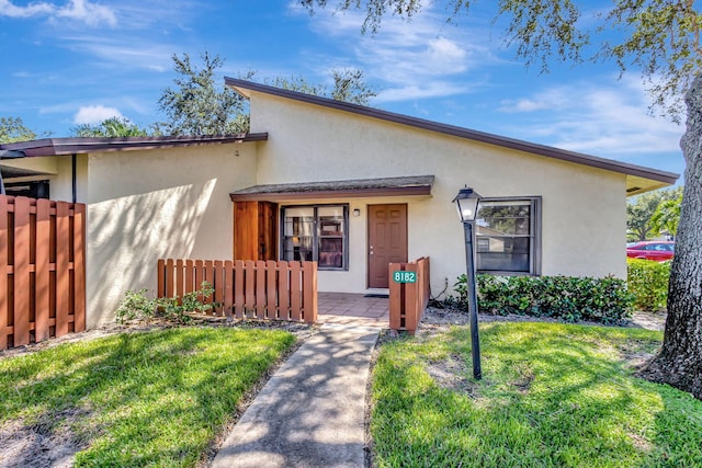 bungalow with a front yard