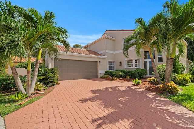 mediterranean / spanish-style home featuring a garage