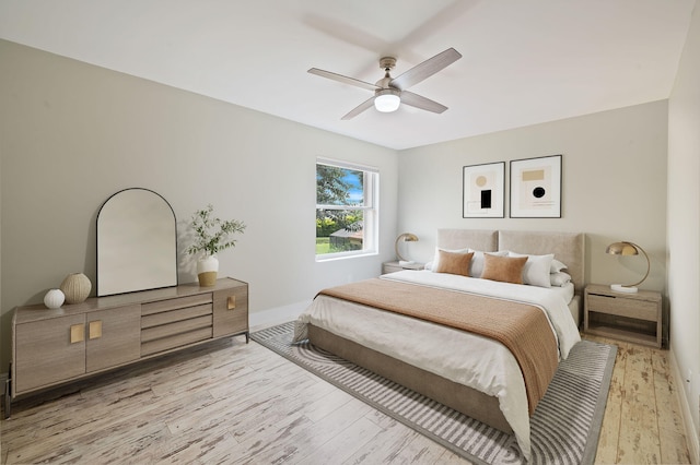 bedroom featuring light hardwood / wood-style flooring and ceiling fan