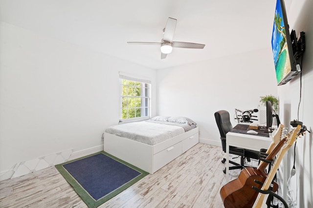 bedroom featuring ceiling fan and light hardwood / wood-style flooring